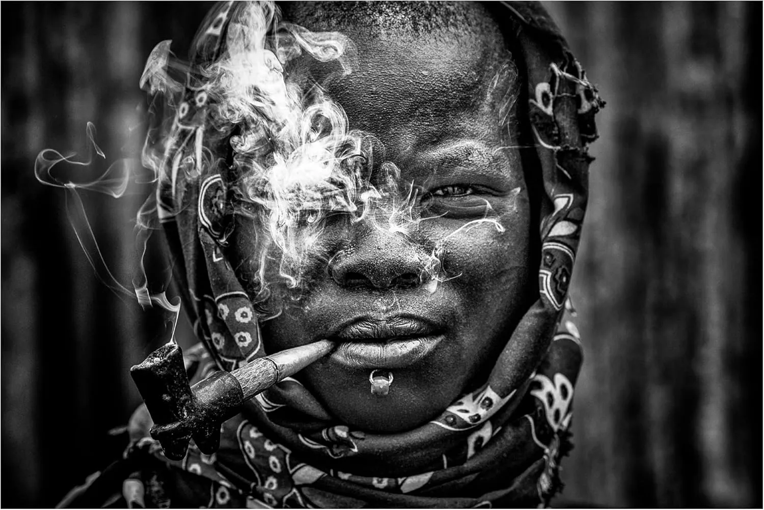 Trademark Fine Art Canvas Wall Art - Joxe Inazio Kuesta 'Laarim Woman Smoking South Sudan' Wall Art for Living Room, Bedroom, or Office Décor